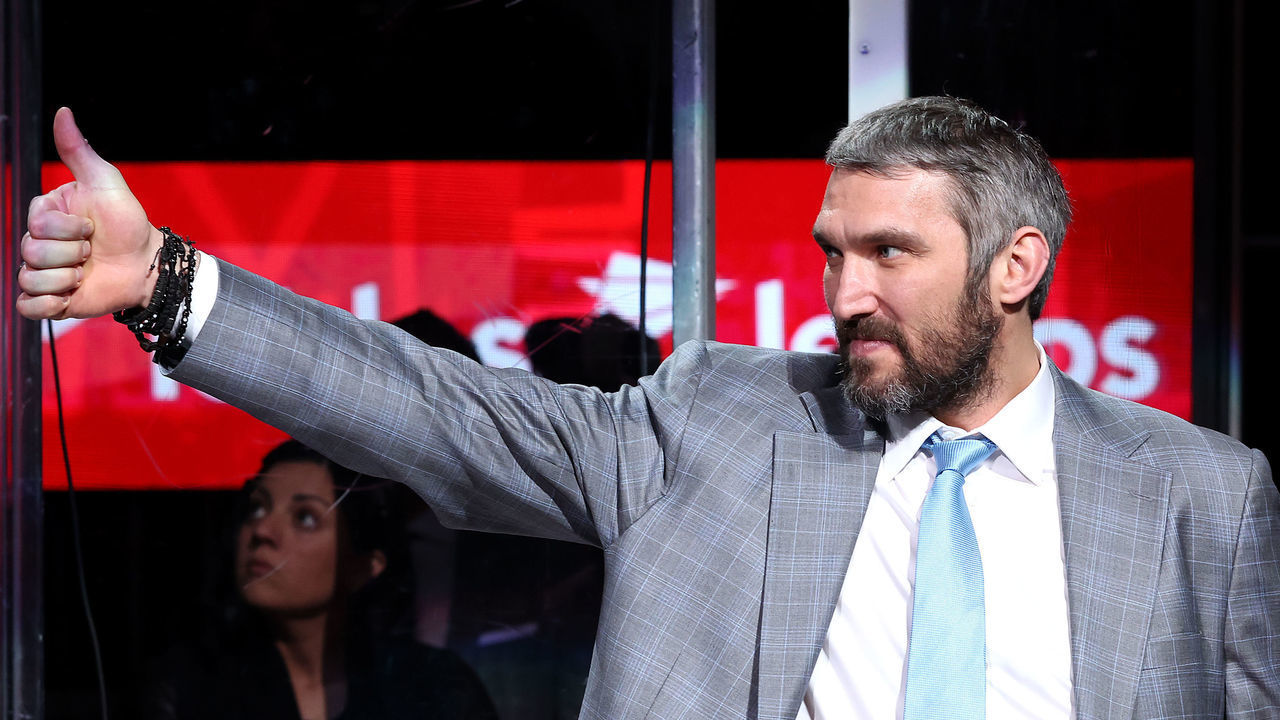 WASHINGTON, DC - APRIL 26: Alex Ovechkin #8 of the Washington Capitals waves during a ceremony honoring him for becoming third all time in goals scored in the NHL before the start of the Capitals and New York Islanders at Capital One Arena on April 26, 2022 in Washington, DC.