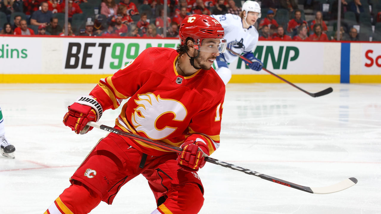 CALGARY, AB - APRIL 23: Johnny Gaudreau #13 of the Calgary Flames skates up ice against the Vancouver Canucks at Scotiabank Saddledome on April 23, 2022 in Calgary, Alberta, Canada.