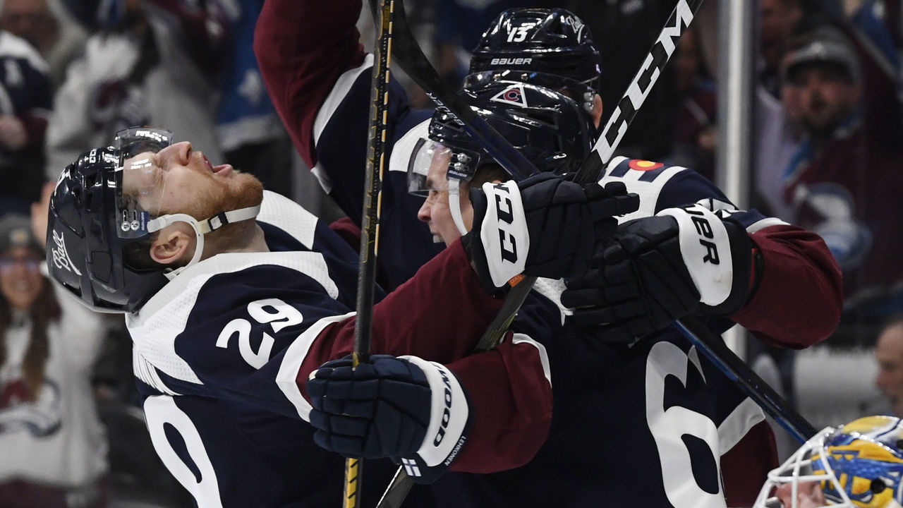 DENVER, CO - APRIL 26: Colorado Avalanche center Nathan MacKinnon (29), left, celebrates with Colorado Avalanche left wing Artturi Lehkonen (62) and Colorado Avalanche right wing Valeri Nichushkin (13) after Lehkonen scored against St. Louis Blues goaltender Jordan Binnington (50) in the third period at Ball Arena April 26, 2022. The Avalanche won 5-3. "n"n