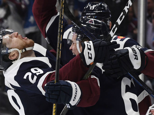 DENVER, CO - APRIL 26: Colorado Avalanche center Nathan MacKinnon (29), left, celebrates with Colorado Avalanche left wing Artturi Lehkonen (62) and Colorado Avalanche right wing Valeri Nichushkin (13) after Lehkonen scored against St. Louis Blues goaltender Jordan Binnington (50) in the third period at Ball Arena April 26, 2022. The Avalanche won 5-3. "n"n