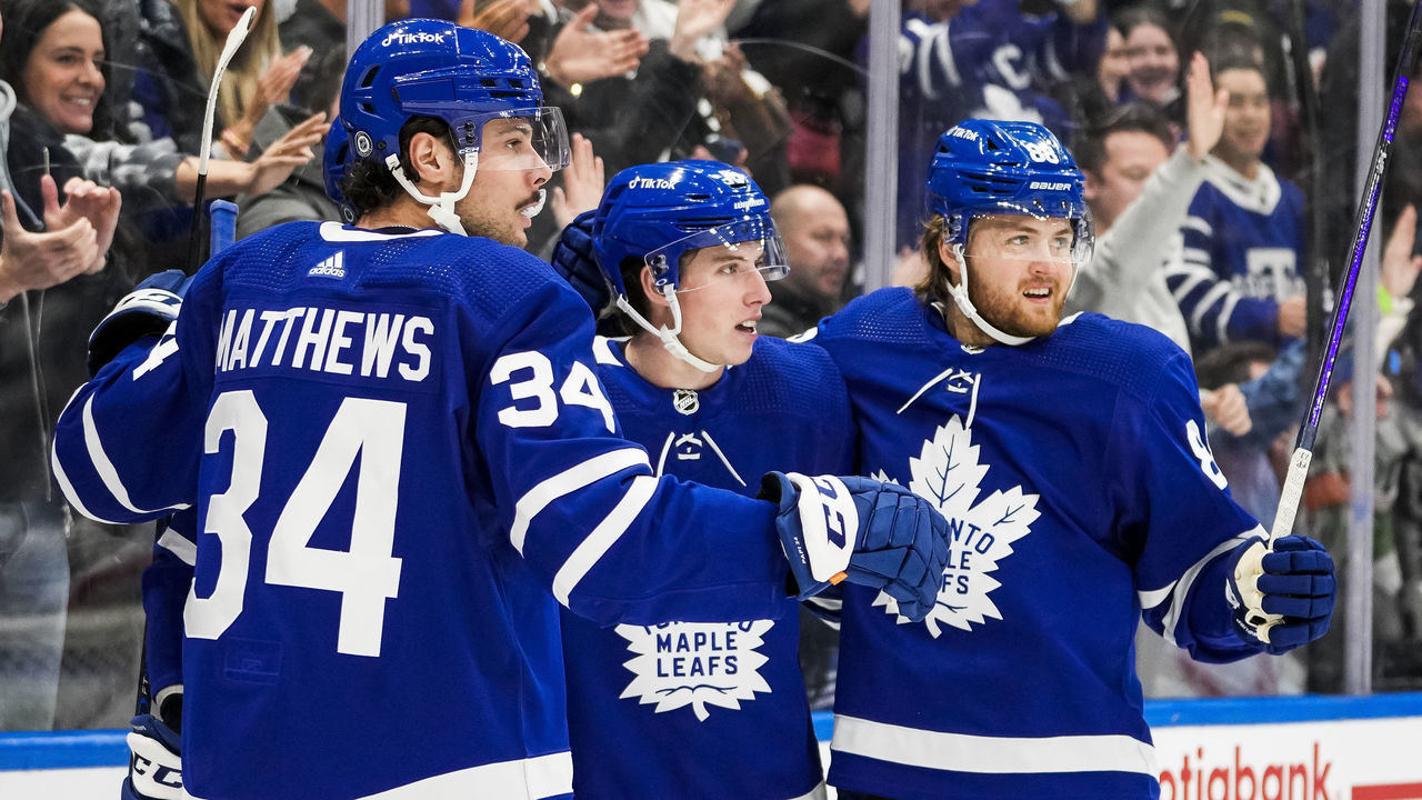 TORONTO, ON - MARCH 27: John Tavares #91 of the Toronto Maple Leafs celebrates scoring a goal with teammates Auston Matthews #34, Mitchell Marner #16 and William Nylander #88 during the second period against the Florida Panthers at the Scotiabank Arena on March 27, 2022 in Toronto, Ontario, Canada.