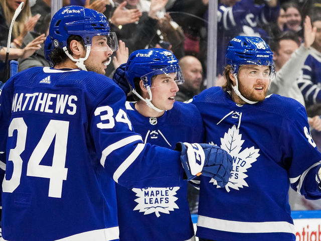 TORONTO, ON - MARCH 27: John Tavares #91 of the Toronto Maple Leafs celebrates scoring a goal with teammates Auston Matthews #34, Mitchell Marner #16 and William Nylander #88 during the second period against the Florida Panthers at the Scotiabank Arena on March 27, 2022 in Toronto, Ontario, Canada.