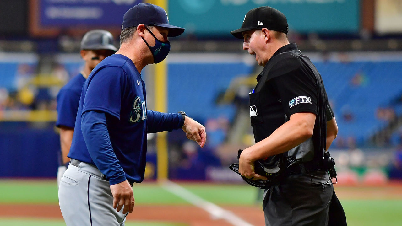 ST PETERSBURG, FLORIDA - APRIL 28: Manager Scott Servais #9 of the Seattle Mariners protests a call by umpire Shane Livensparger #43 in the fifth inning against the Tampa Bay Rays at Tropicana Field on April 28, 2022 in St Petersburg, Florida.