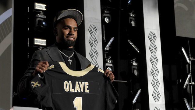 LAS VEGAS, NEVADA - APRIL 28: Chris Olave poses onstage after being selected 11th by the New Orleans Saints during round one of the 2022 NFL Draft on April 28, 2022 in Las Vegas, Nevada.