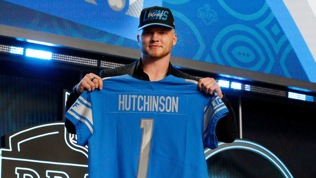 LAS VEGAS, NV - APRIL 28: Aidan Hutchinson, Michigan poses with his jersey as he is selected as the overall number two draft pick by the Detroit Lions during the NFL Draft on April 28, 2022 in Las Vegas, Nevada.