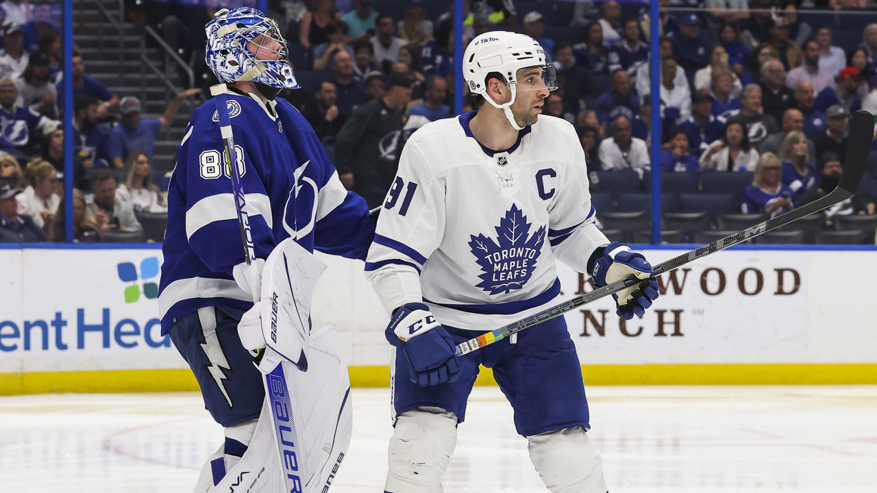 TAMPA, FL - APRIL 21: Andrei Vasilevskiy #88 of the Tampa Bay Lightning skates against John Tavares #91 of the Toronto Maple Leafs during the second period at Amalie Arena on April 21, 2022 in Tampa, Florida.