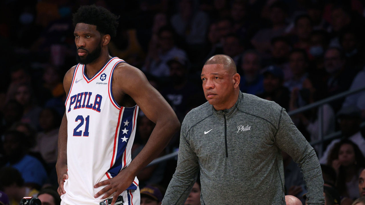 LOS ANGELES, CALIFORNIA - MARCH 23: Joel Embiid #21 and Doc Rivers watch play from the sidelines during the first half against the Los Angeles Lakers at Crypto.com Arena on March 23, 2022 in Los Angeles, California. NOTE TO USER: User expressly acknowledges and agrees that, by downloading and/or using this Photograph, user is consenting to the terms and conditions of the Getty Images License Agreement. Mandatory Copyright Notice: Copyright 2022 NBAE