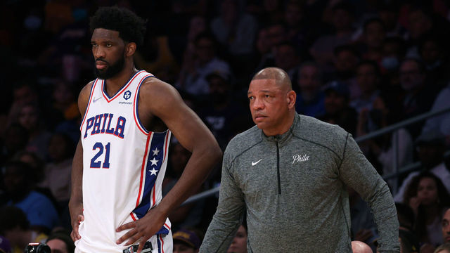 LOS ANGELES, CALIFORNIA - MARCH 23: Joel Embiid #21 and Doc Rivers watch play from the sidelines during the first half against the Los Angeles Lakers at Crypto.com Arena on March 23, 2022 in Los Angeles, California. NOTE TO USER: User expressly acknowledges and agrees that, by downloading and/or using this Photograph, user is consenting to the terms and conditions of the Getty Images License Agreement. Mandatory Copyright Notice: Copyright 2022 NBAE