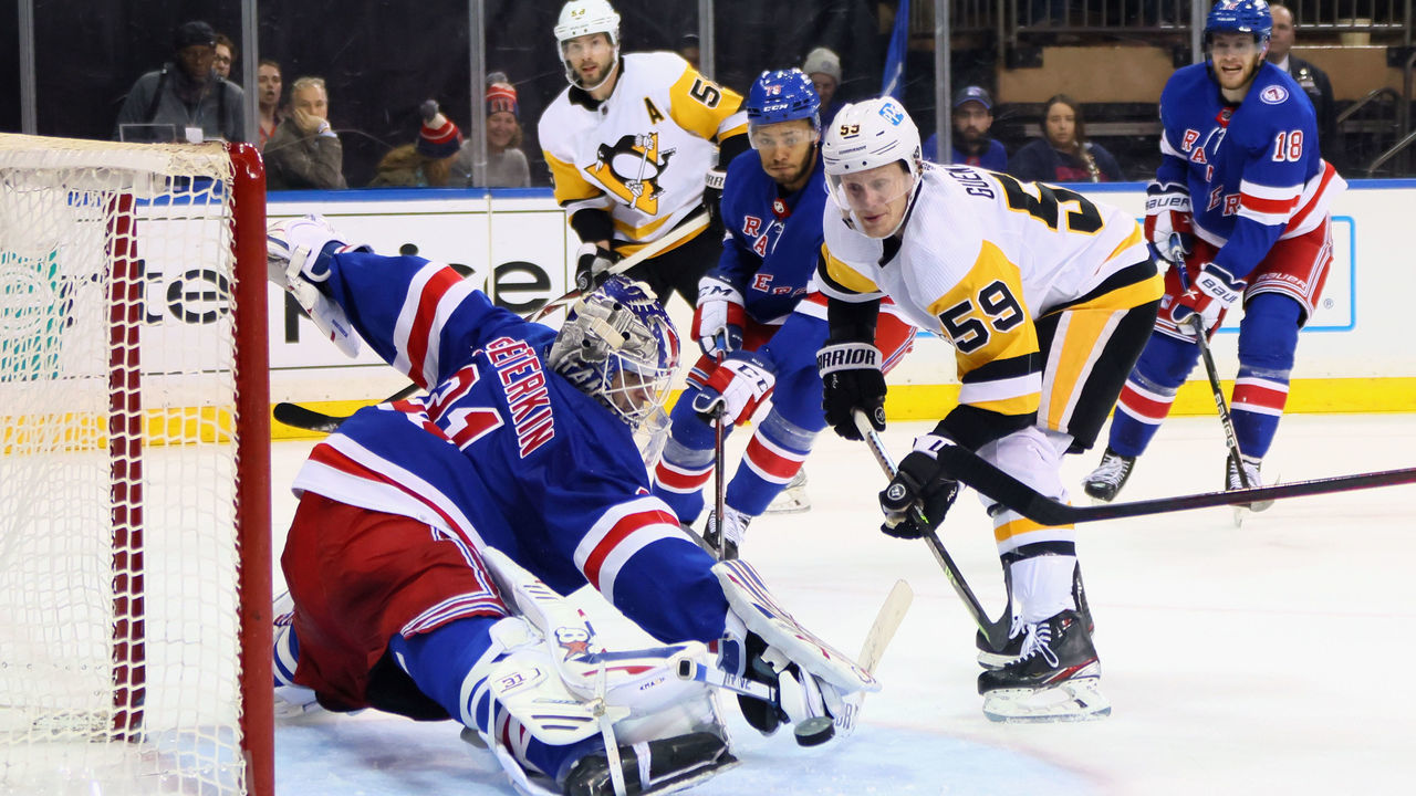 NEW YORK, NEW YORK - APRIL 07: Igor Shesterkin #31 of the New York Rangers makes a third period save on Jake Guentzel #59 of the Pittsburgh Penguins at Madison Square Garden on April 07, 2022 in New York City. The Rangers shut out the Penguins 3-0.