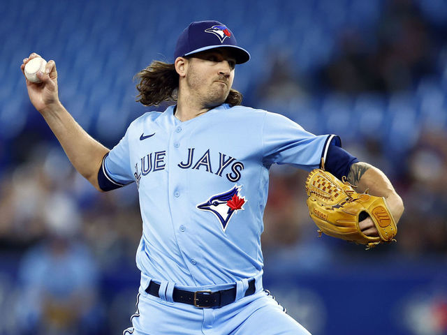 Gosuke Katoh of the Toronto Blue Jays in the dugout ahead of their