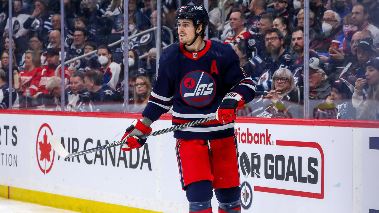 WINNIPEG, MB - APRIL 06: Mark Scheifele #55 of the Winnipeg Jets keeps an eye on the play during third period action against the Detroit Red Wings at Canada Life Centre on April 06, 2022 in Winnipeg, Manitoba, Canada.
