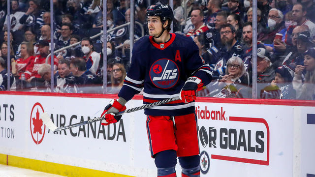WINNIPEG, MB - APRIL 06: Mark Scheifele #55 of the Winnipeg Jets keeps an eye on the play during third period action against the Detroit Red Wings at Canada Life Centre on April 06, 2022 in Winnipeg, Manitoba, Canada.