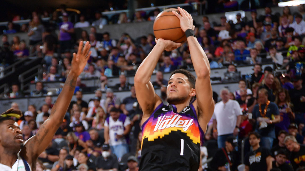 PHOENIX, AZ - MAY 2: Devin Booker #1 of the Phoenix Suns shoots a three point basket against the Dallas Mavericks during Game 1 of the 2022 NBA Playoffs Western Conference Semifinals on May 2, 2022 at Footprint Center in Phoenix, Arizona. Mandatory Copyright Notice: Copyright 2022 NBAE