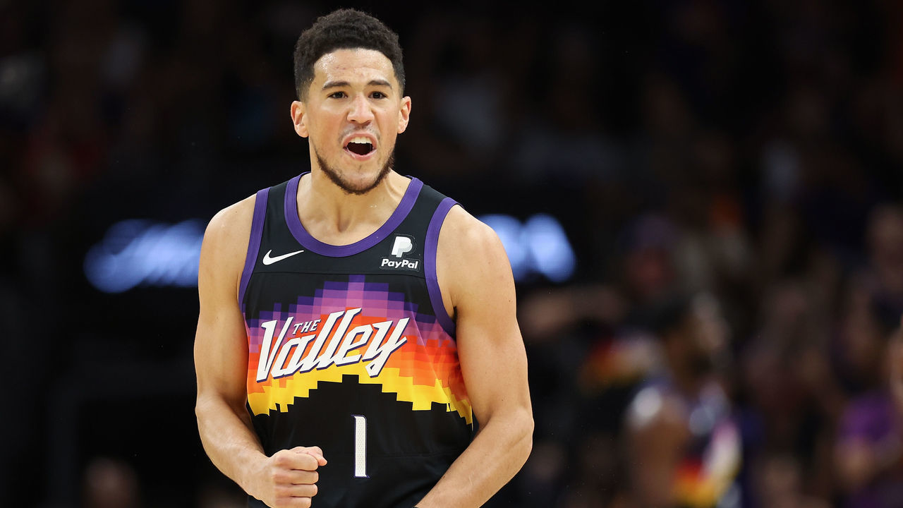 PHOENIX, ARIZONA - MAY 02: Devin Booker #1 of the Phoenix Suns reacts after scoring against the Dallas Mavericks during the first half of Game One of the Western Conference Second Round NBA Playoffs at Footprint Center on May 02, 2022 in Phoenix, Arizona.