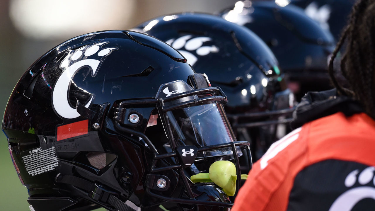 CINCINNATI, OH - NOVEMBER 06: A Cincinnati helmet sits on the side line during a college football game between the Tulsa Golden Hurricane and Cincinnati Bearcats on November 6, 2021 at Nippert Stadium in Cincinnati, OH.