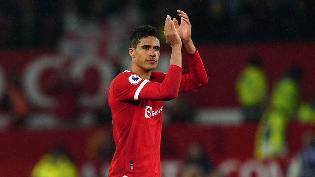 Manchester United's Raphael Varane applauds the fans following the Premier League match at Old Trafford, Manchester. Picture date: Monday May 2, 2022.