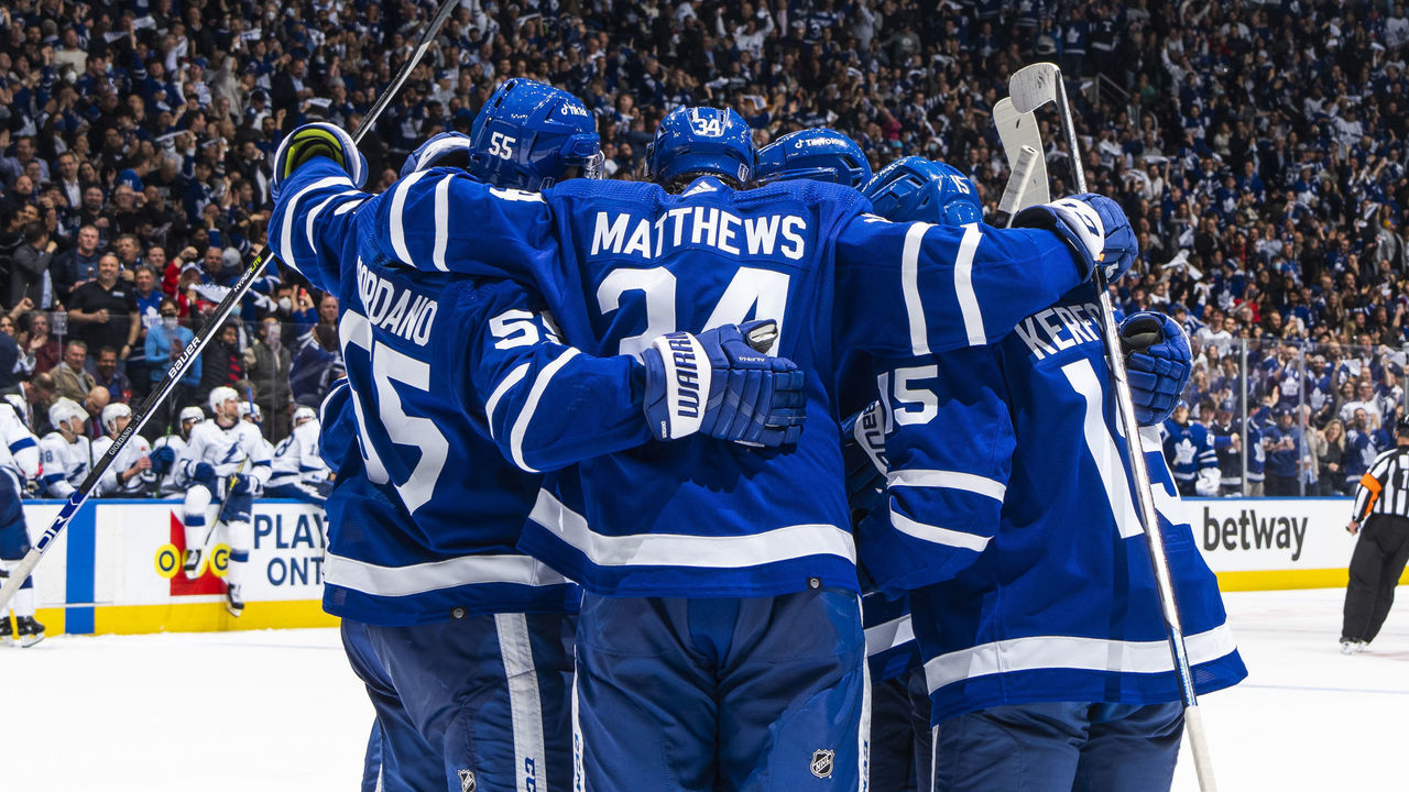 TORONTO, ON - MAY 2: Auston Matthews #34 of the Toronto Maple Leafs celebrates his second goal of the night against the Tampa Bay Lightning with teammates Mark Giordano #55 and Alex Kerfoot during the third period in Game One of the First Round of the 2022 Stanley Cup Playoffs at the Scotiabank Arena on May 2, 2022 in Toronto, Ontario, Canada.