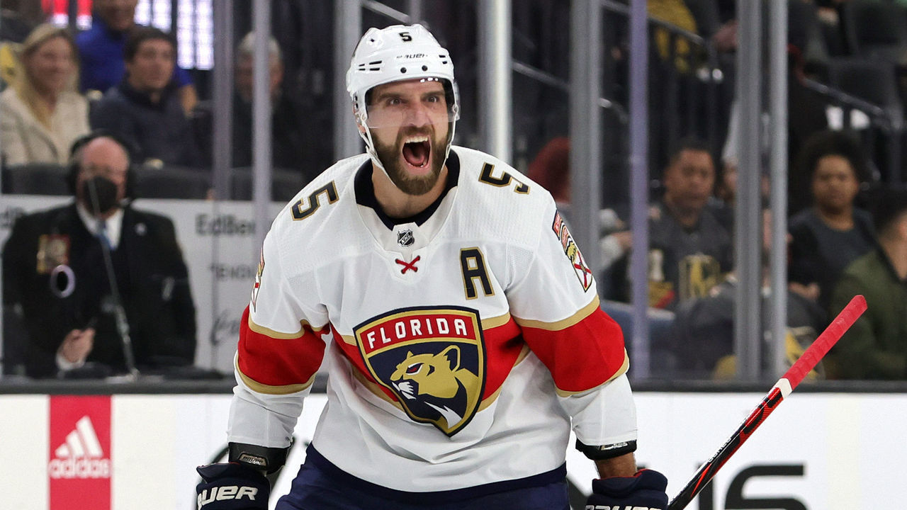 LAS VEGAS, NEVADA - MARCH 17: Aaron Ekblad #5 of the Florida Panthers reacts after his shot from the point was deflected into the goal by teammate Sam Reinhart #13 for a third-period power-play goal against the Vegas Golden Knights during their game at T-Mobile Arena on March 17, 2022 in Las Vegas, Nevada. The Golden Knights defeated the Panthers 5-3.