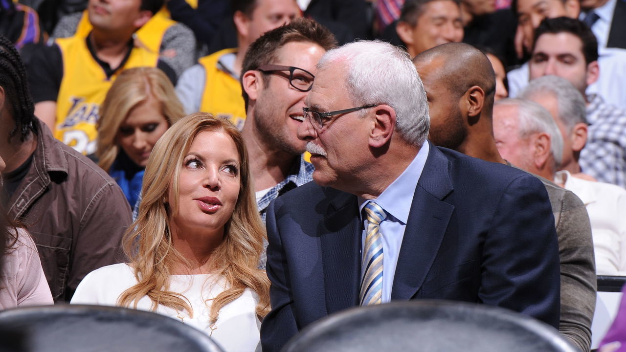 LOS ANGELES, CA - APRIL 2: Executive Vice President of Business Operations Jeanie Buss and former NBA coach Phil Jackson look on during a game between the Dallas Mavericks and the Los Angeles Lakers at Staples Center on April 2, 2013 in Los Angeles, California. NOTE TO USER: User expressly acknowledges and agrees that, by downloading and/or using this Photograph, user is consenting to the terms and conditions of the Getty Images License Agreement. Mandatory Copyright Notice: Copyright 2013 NBAE