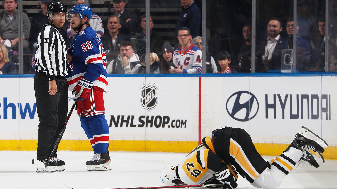 NEW YORK, NEW YORK - MAY 03: Rickard Rakell #67 of the Pittsburgh Penguins lies on the ice after being hit by Ryan Lindgren #55 of the New York Rangers in Game One of the First Round of the 2022 Stanley Cup Playoffs at Madison Square Garden on May 03, 2022 in New York City.