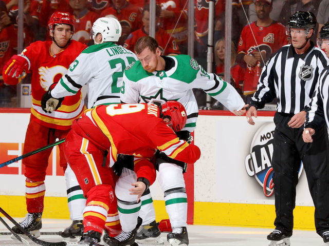 CALGARY, ALBERTA - MAY 03: Matthew Tkachuk #19 of the Calgary Flames fights Michael Raffl #18 of the Dallas Stars in Game One of the First Round of the 2022 Stanley Cup Playoffs at Scotiabank Saddledome on May 03, 2022 in Calgary, Alberta.