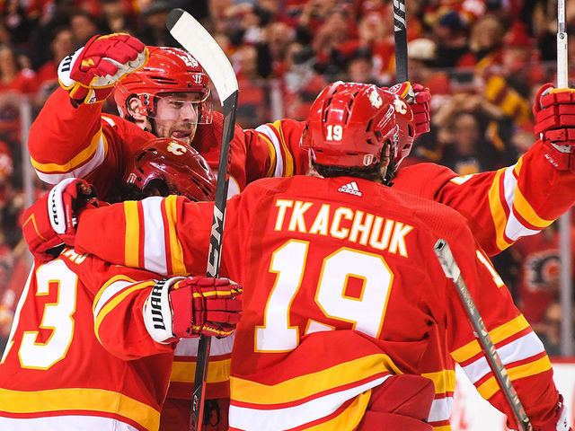 CALGARY, AB - MAY 3: Elias Lindholm #28 of the Calgary Flames celebrates with his teammates after scoring against the Dallas Stars during the first period of Game One of the First Round of the 2022 Stanley Cup Playoffs at Scotiabank Saddledome on May 3, 2022 in Calgary, Alberta, Canada.