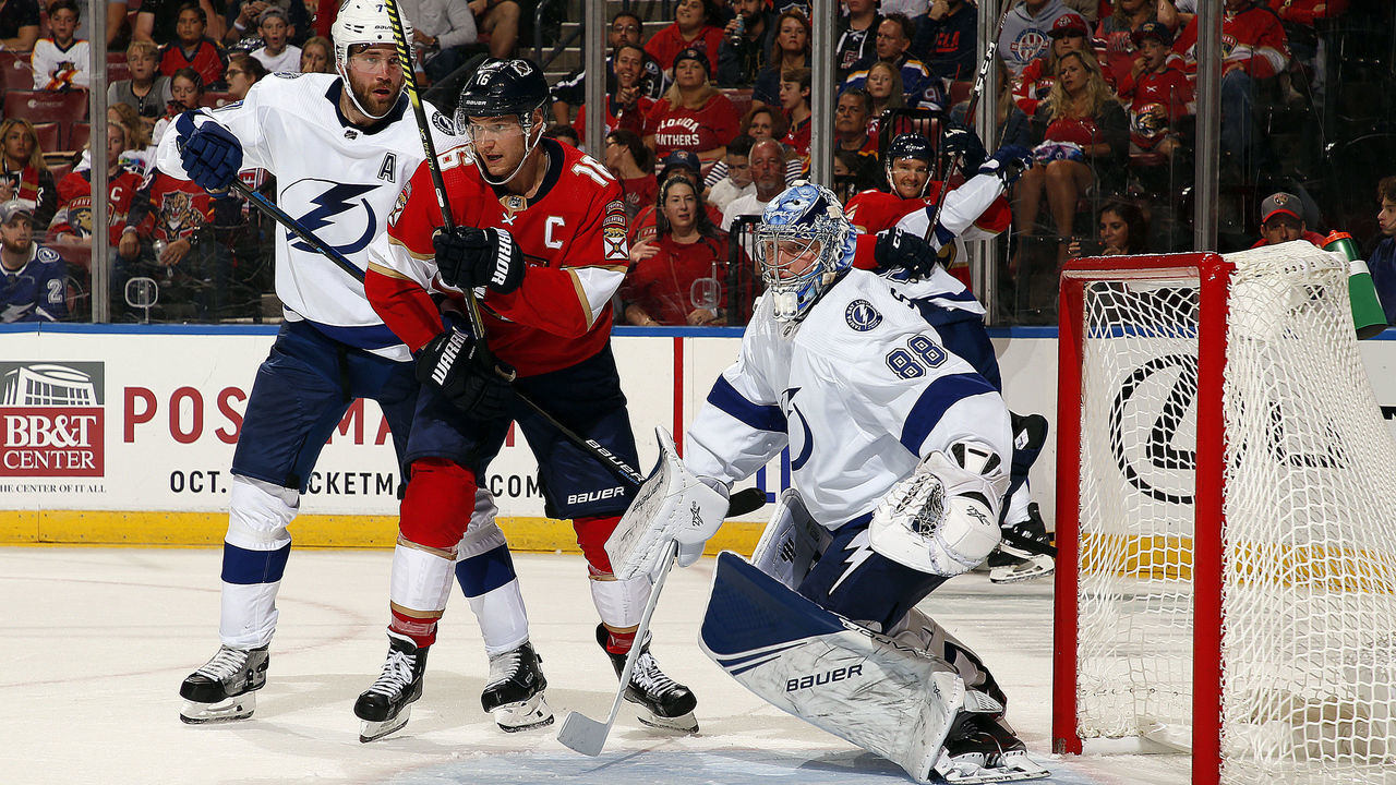 SUNRISE, FL - OCT. 5: Goaltender Andrei Vasilevskly of the Tampa Bay Lightning defends the net with the help of teammate Victor Hedman #77 against Aleksander Barkov #16 of the Florida Panthers at the BB&T Center on October 5, 2019 in Sunrise, Florida.