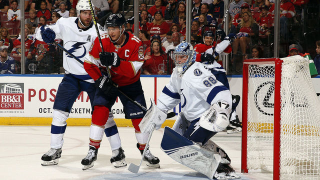 SUNRISE, FL - OCT. 5: Goaltender Andrei Vasilevskly of the Tampa Bay Lightning defends the net with the help of teammate Victor Hedman #77 against Aleksander Barkov #16 of the Florida Panthers at the BB&T Center on October 5, 2019 in Sunrise, Florida.