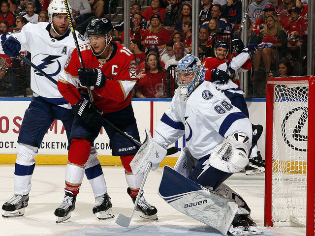 SUNRISE, FL - OCT. 5: Goaltender Andrei Vasilevskly of the Tampa Bay Lightning defends the net with the help of teammate Victor Hedman #77 against Aleksander Barkov #16 of the Florida Panthers at the BB&T Center on October 5, 2019 in Sunrise, Florida.