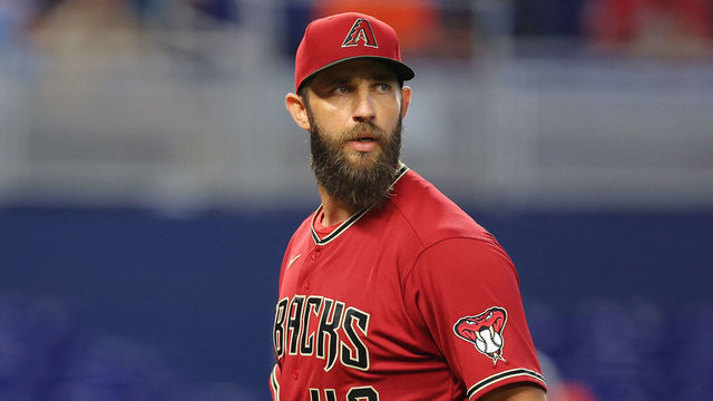 MIAMI, FLORIDA - MAY 04: Madison Bumgarner #40 of the Arizona Diamondbacks yells at umpire Dan Bellino #2 before being ejected from the game as he walks off the mound during the first inning against the Miami Marlins at loanDepot park on May 04, 2022 in Miami, Florida.