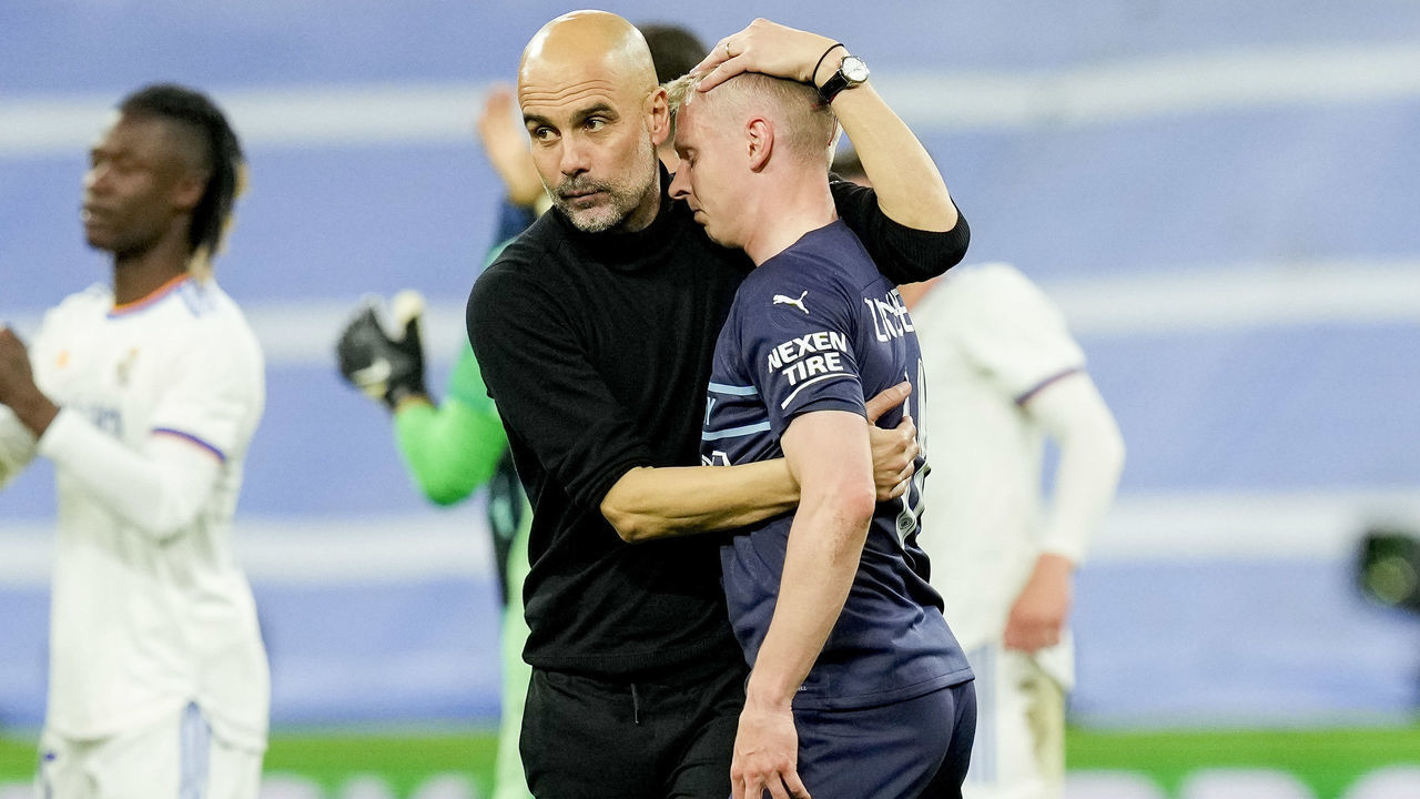 MADRID, SPAIN - MAY 04: head coach Pep Guardiola of Manchester City and Oleksandr Zinchenko of Manchester City looks dejected after the UEFA Champions League Semi Final Leg Two match between Real Madrid and Manchester City at Estadio Santiago Bernabeu on May 4, 2022 in Madrid, Spain.