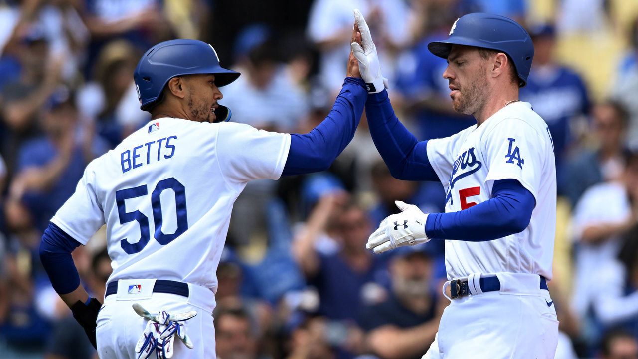 Los Angeles, CA - April 20:Los Angeles, CA - April 20:Los Angeles, CA - April 20:Dodgers Mookie Betts, #50, greets Freddie Freeman, #5, after they scored during game action at Dodger Stadium Wednesday, April 20, 2022. The Dodgers defeated the Atlanta Braves 7-1.