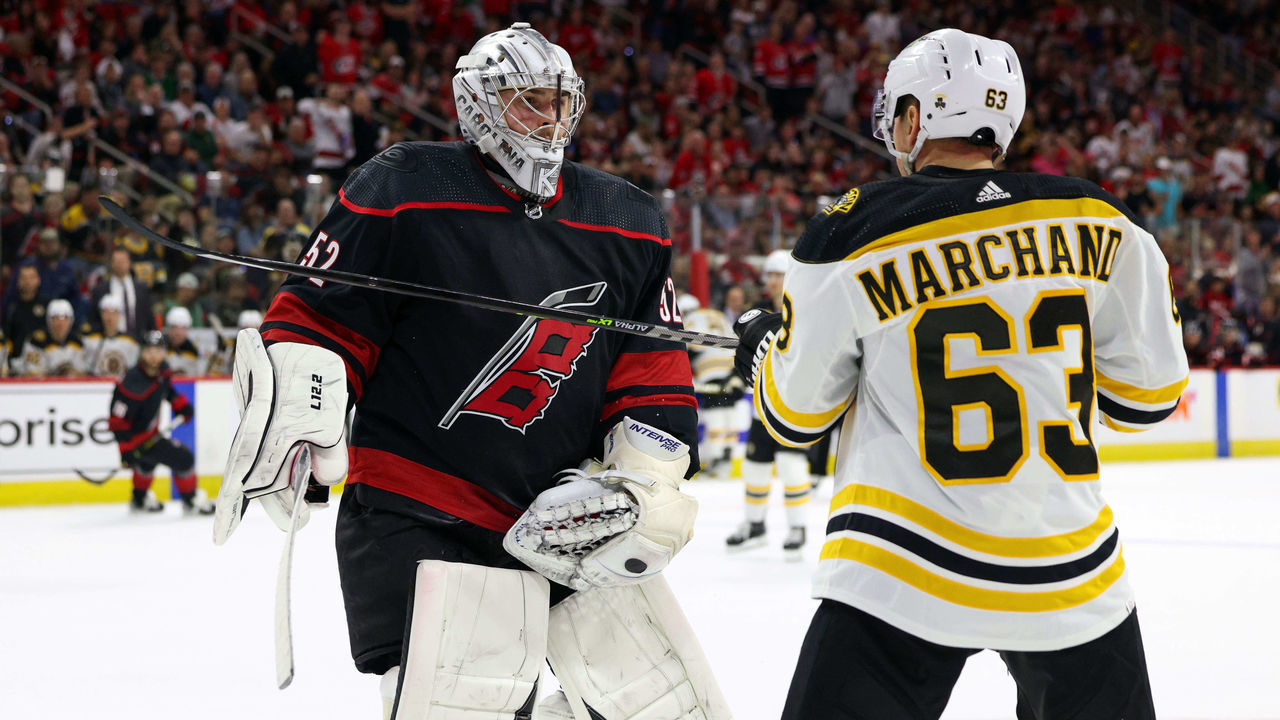 RALEIGH, NC - MAY 4: Goaltender Pyotr Kochetkov #52 of the Carolina Hurricanes squares up after a hit in the crease from Brad Marchand #63 of the Boston Bruins in Game Two of the First Round of the 2022 Stanley Cup Playoffs on May 4, 2022 at PNC Arena in Raleigh, North Carolina.