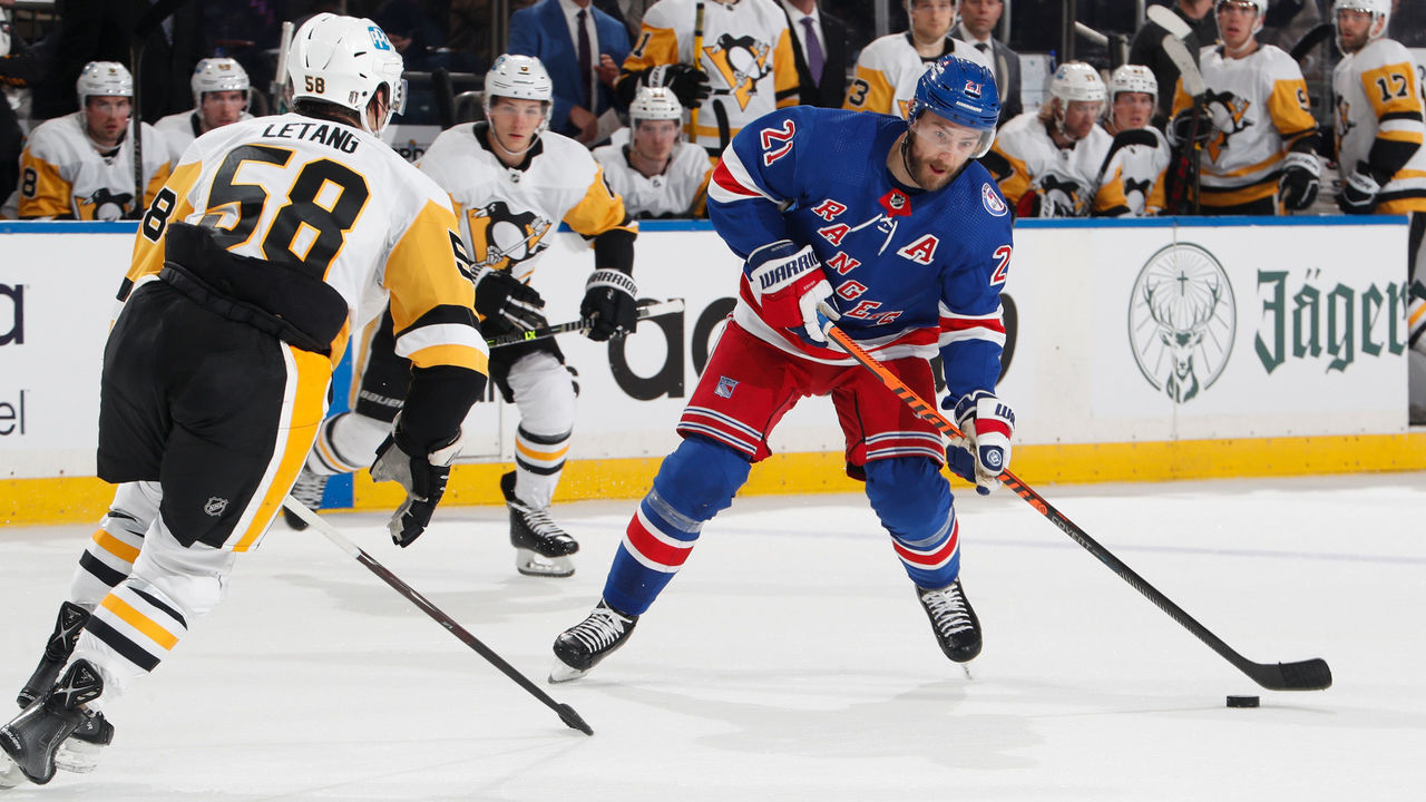 NEW YORK, NY - MAY 03: Barclay Goodrow #21 of the New York Rangers skates with the puck against Kris Letang #58 of the Pittsburgh Penguins in Game One of the First Round of the 2022 Stanley Cup Playoffs at Madison Square Garden on May 3, 2022 in New York City.