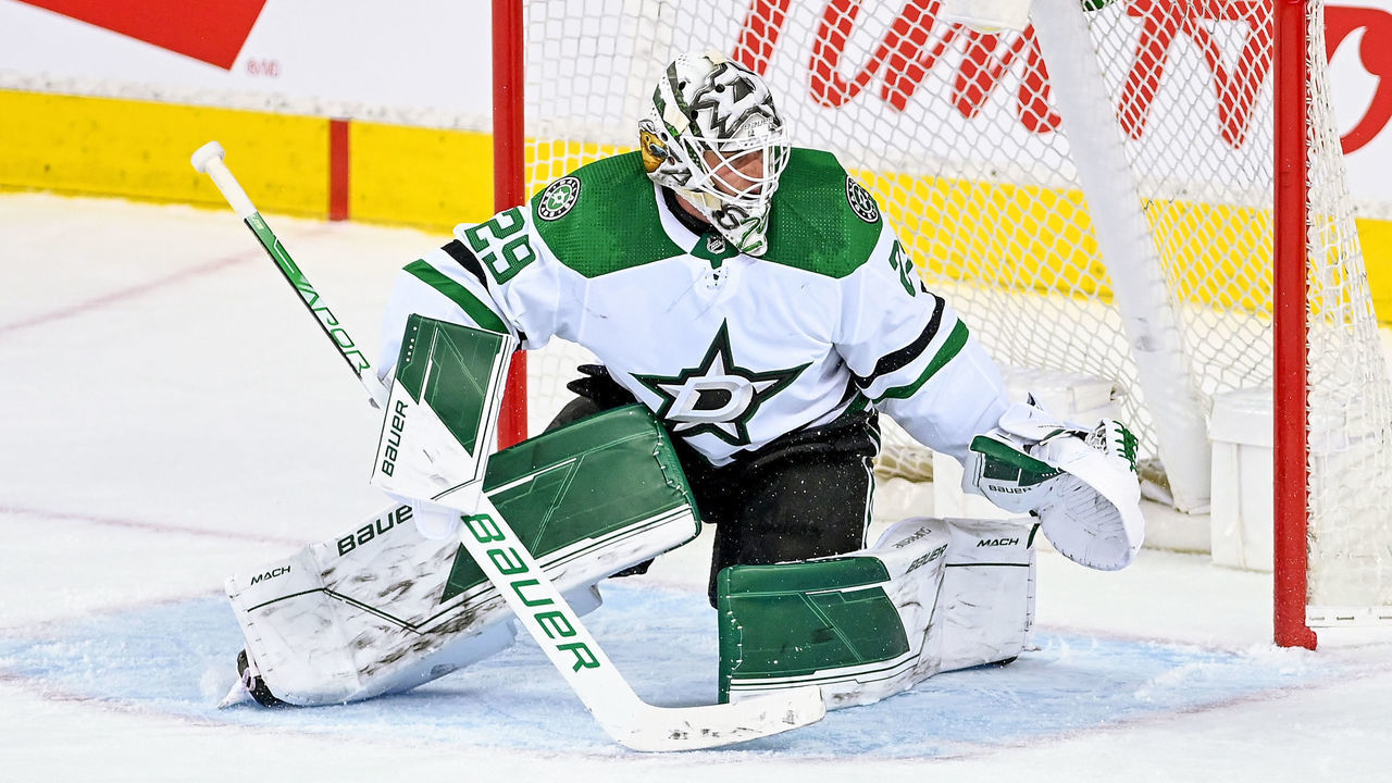 CALGARY, AB - MAY 03: Dallas Stars Goalie Jake Oettinger (29) covers his net during the third period of game 1 of the first round of the NHL Stanley Cup Playoffs between the Calgary Flames and the Dallas Stars on May 3, 2022, at the Scotiabank Saddledome in Calgary, AB.