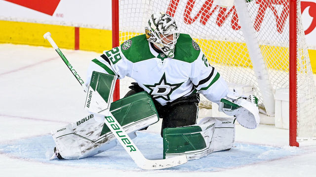 CALGARY, AB - MAY 03: Dallas Stars Goalie Jake Oettinger (29) covers his net during the third period of game 1 of the first round of the NHL Stanley Cup Playoffs between the Calgary Flames and the Dallas Stars on May 3, 2022, at the Scotiabank Saddledome in Calgary, AB.