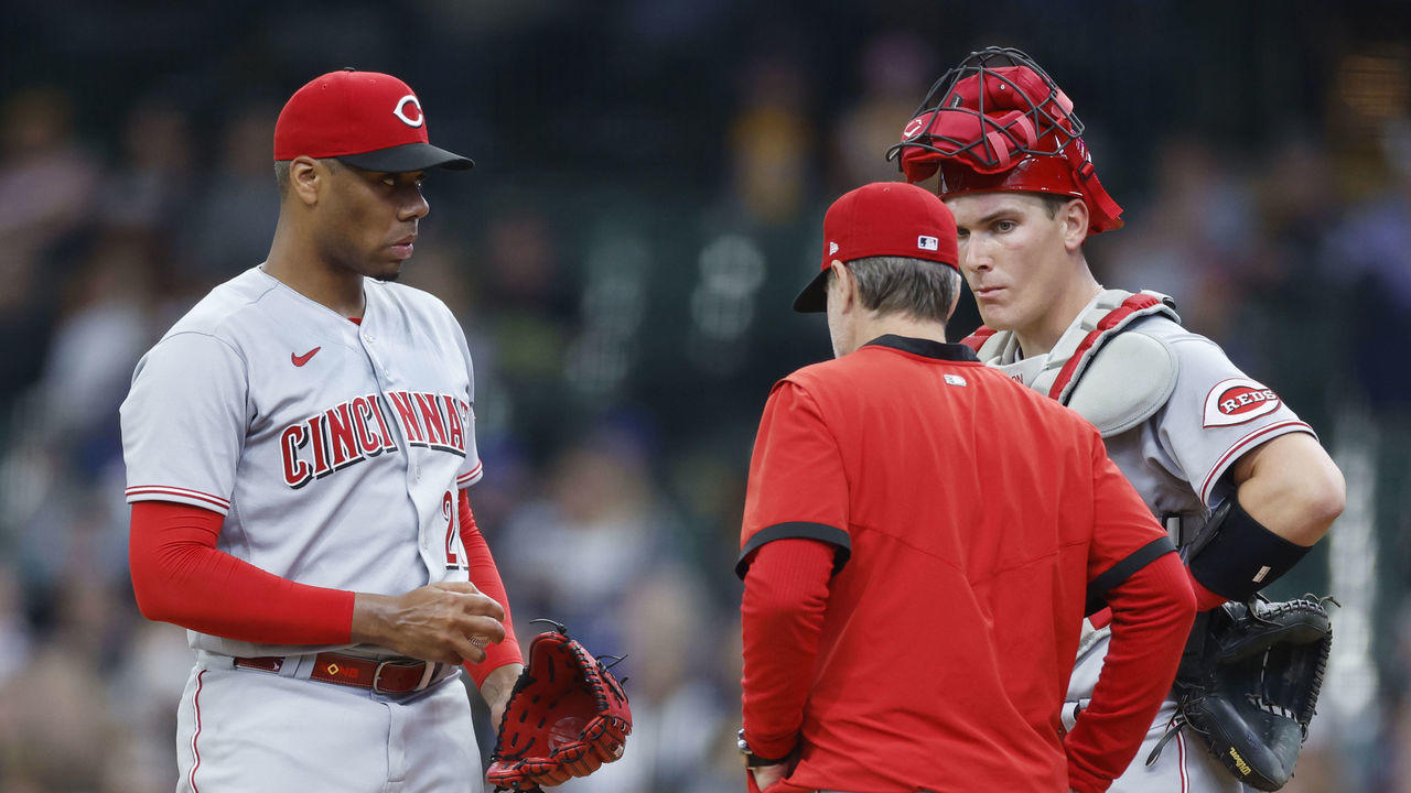 MILWAUKEE, WI - MAY 05: Cincinnati Reds starting pitcher Hunter Greene (21) talks to manager David Bell and catcher Tyler Stephenson (37) before being taken out of the MLB game against the Milwaukee Brewers on May 5, 2022 at American Family Field in Milwaukee, Wisconsin.