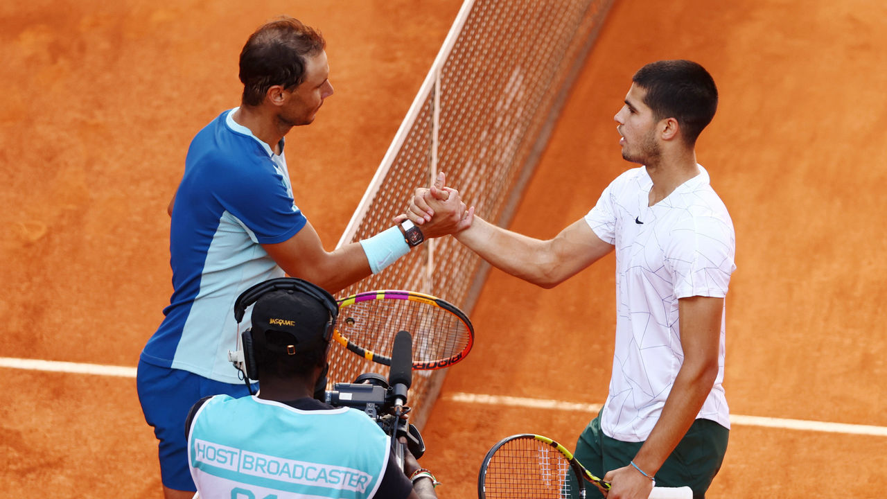 MADRID, SPAIN - MAY 06: Carlos Alcaraz Garfia of Spain (R) and Rafael Nadal of Spain interact following their quarter-final match during day nine of Mutua Madrid Open at La Caja Magica on May 06, 2022 in Madrid, Spain.