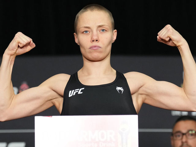PHOENIX, ARIZONA - MAY 06: Rose Namajunas poses on the scale during the UFC 274 official weigh-in at the Hyatt Regency hotel on May 06, 2022 in Phoenix, Arizona.