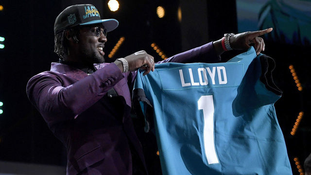 LAS VEGAS, NEVADA - APRIL 28: Devin Lloyd poses onstage after being selected 27th by the Jacksonville Jaguars during round one of the 2022 NFL Draft on April 28, 2022 in Las Vegas, Nevada.