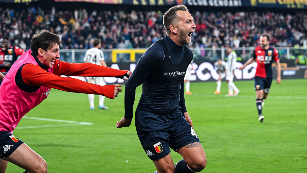 GENOA, ITALY - MAY 6: Domenico Criscito of Genoa (C) celebrates with his team-mate Andrea Cambiaso after scoring a goal from the penalty spot during the Serie A match between Genoa CFC and Juventus at Stadio Luigi Ferraris on April 30, 2022 in Genoa, Italy.