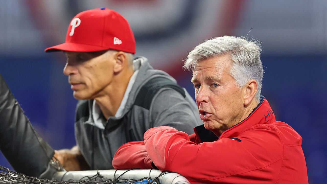 MIAMI, FLORIDA - APRIL 14: Manager Joe Girardi #25 and President of Baseball Operations Dave Dombrowski of the Philadelphia Phillies look on during batting practice prior to the game against the Miami Marlins at loanDepot park on April 14, 2022 in Miami, Florida.