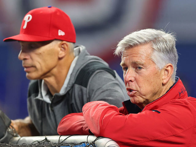 MIAMI, FLORIDA - APRIL 14: Manager Joe Girardi #25 and President of Baseball Operations Dave Dombrowski of the Philadelphia Phillies look on during batting practice prior to the game against the Miami Marlins at loanDepot park on April 14, 2022 in Miami, Florida.
