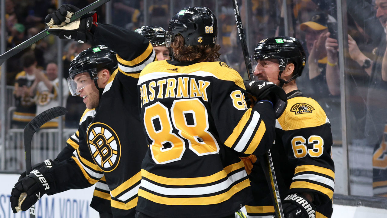 BOSTON, MASSACHUSETTS - MAY 06: Taylor Hall #71 of the Boston Bruins celebrates with Brad Marchand #63 and David Pastrnak #88 after scoring a goal against the Carolina Hurricanes during the third period of Game Three of the First Round of the 2022 Stanley Cup Playoffs at TD Garden on May 06, 2022 in Boston, Massachusetts.