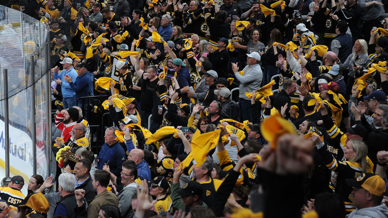 BOSTON, MA - MAY 06: Fans of the Boston Bruins wave their rally towels after the first period goal against the Carolina Hurricanes in Game Three of the First Round of the 2022 Stanley Cup Playoffs at the TD Garden on May 6, 2022 in Boston, Massachusetts.