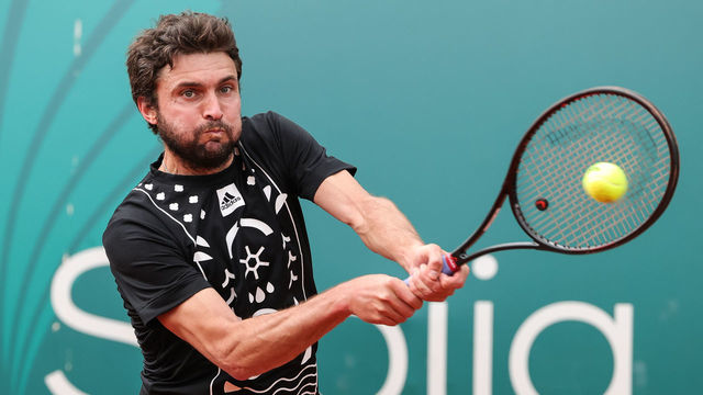 BELGRADE, SERBIA - APRIL 17: Gilles Simon of France returns the ball to Damir Dzumhur of Bosnia and Hercegovina during the qualifications Serbia Open ATP 250 Tournament match at Novak Tennis Centre on April 17, 2022 in Belgrade, Serbia.