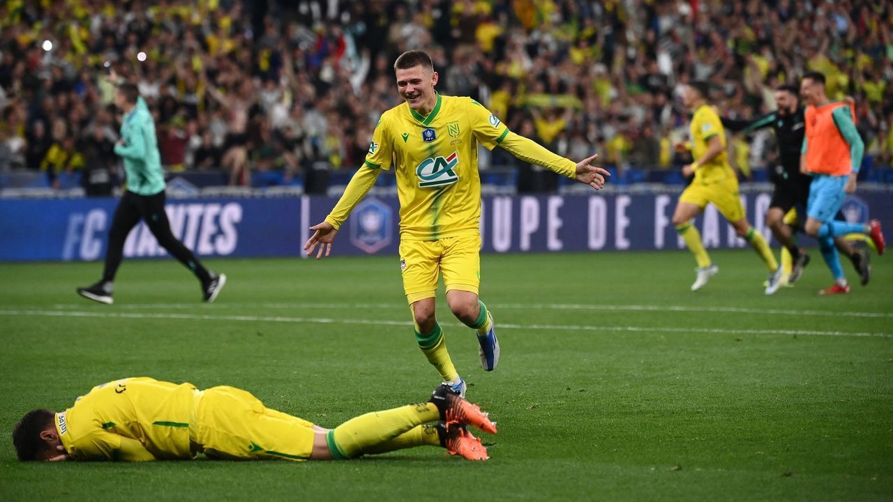 Nantes' players celebrate at the end of the French Cup final football match between OGC Nice and FC Nantes at the Stade de France, in Saint-Denis, on the outskirts of Paris, on May 7, 2022.