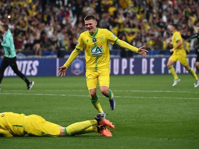 Nantes' players celebrate at the end of the French Cup final football match between OGC Nice and FC Nantes at the Stade de France, in Saint-Denis, on the outskirts of Paris, on May 7, 2022.