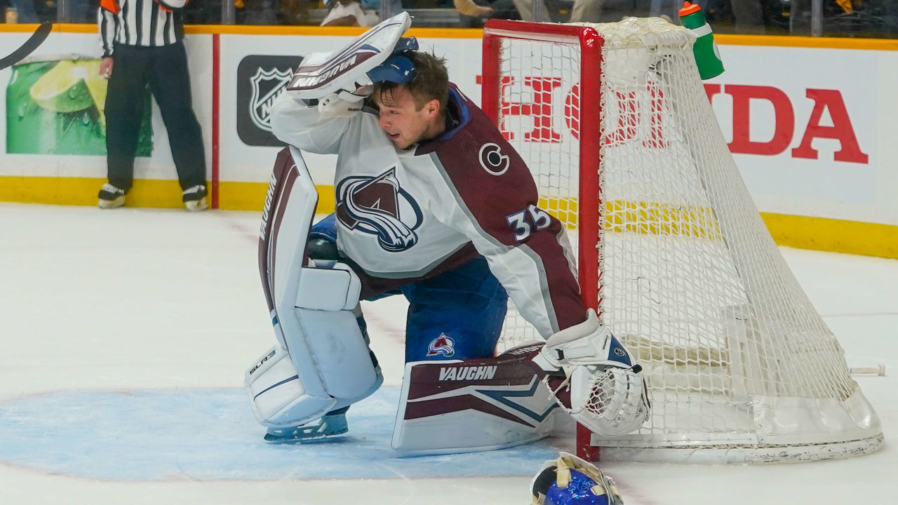 NASHVILLE, TENNESSEE - MAY 07: Darcy Kuemper #35 of the Colorado Avalanche yanks off his mask after being hit by a stick in the first period during Game Three of the First Round of the NHL Playoffs at Bridgestone Arena on May 07, 2022 in Nashville, Tennessee. Kuemper came out of the game after the play.