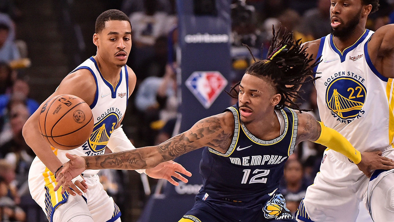 MEMPHIS, TENNESSEE - MAY 03: Ja Morant #12 of the Memphis Grizzlies handles the ball against Jordan Poole #3 of the Golden State Warriors during Game Two of the Western Conference Semifinals of the NBA Playoffs at FedExForum on May 03, 2022 in Memphis, Tennessee.